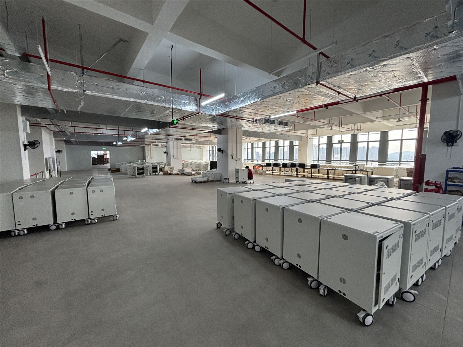 EnTrans charging carts staged across the production floor